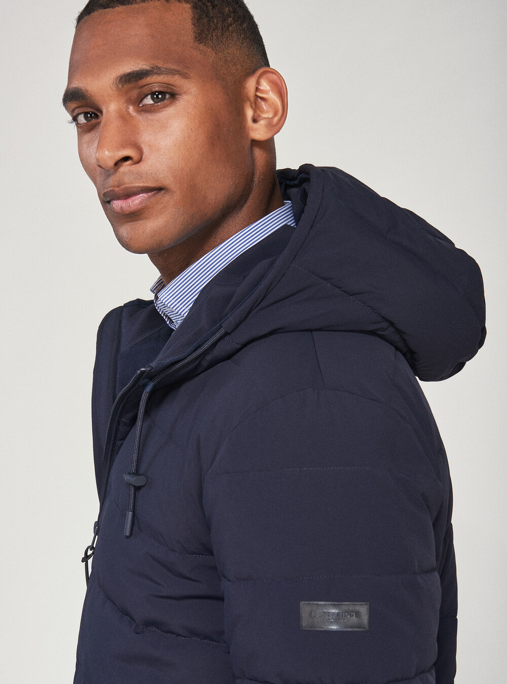 Bomber jacket in technical fabric with hood